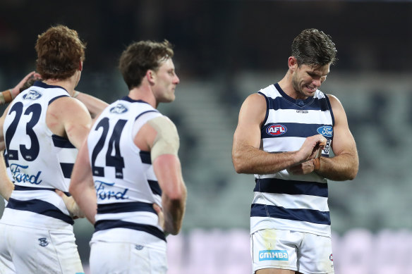 Tom Hawkins (right) says the Cats are still searching for answers.