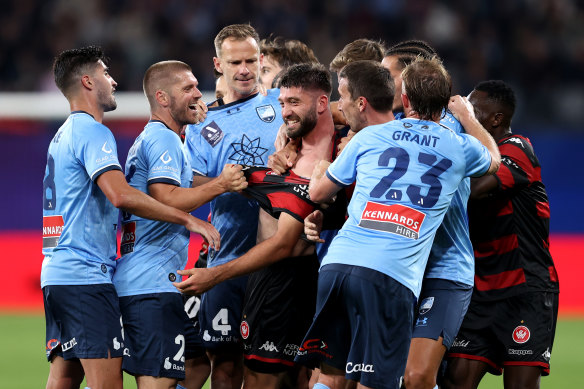 Western Sydney’s Brandon Borello clashes with Sydney FC veteran Alex Wilkinson.