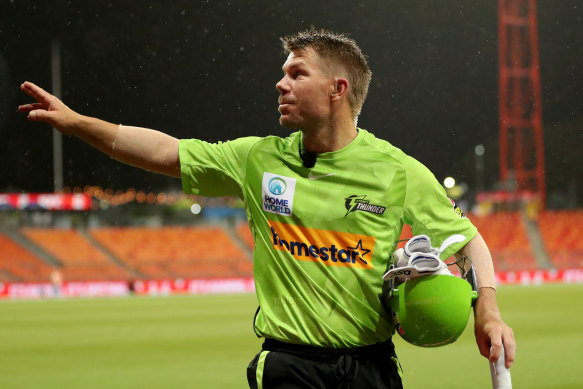 David Warner acknowledges the crowd as he leaves the field due to rain while unbeaten on 36 off 20.