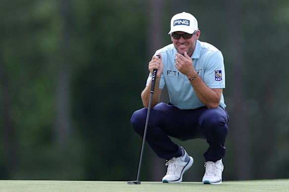 Corey Conners lines up a putt. 
