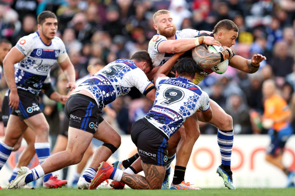 James Fisher-Harris of the Panthers carries a heavy load against the Bulldogs at Panthers Stadium.