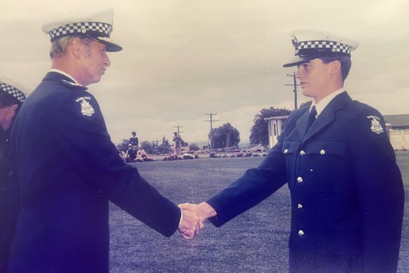 Then chief commissioner Mick Miller with Stephen Wilson (right) at Wilson’s graduation in 1980.