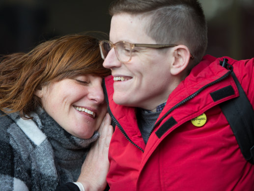 Roz Ward ws embraced by a supporter on her return to La Trobe University in 2016.