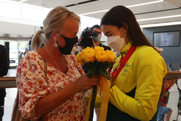 Gold medallist Jakara Anthony is greeted by her mother at Tullamarine.
