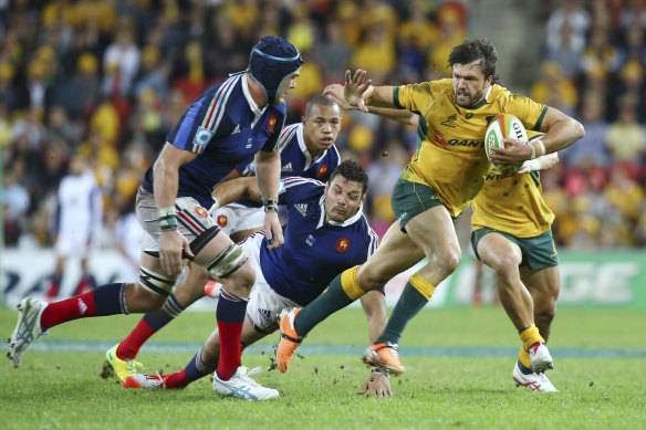 Australian right wing Adam Ashley-Cooper, right, fends off French flanker Bernard le Roux during France’s last trip to Australia in 2014.
