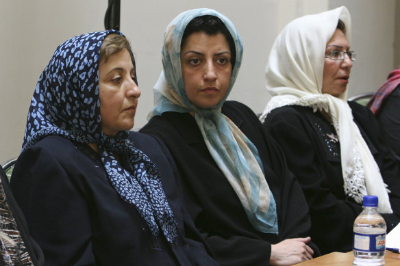 A file photo of Iranian human rights activist Narges Mohammadi, centre, sitting next to Iranian Nobel Peace Prize laureate Shirin Ebadi, left, in 2007.