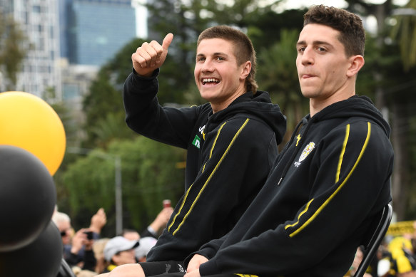 Liam Baker (left) and Jason Castagna at the grand final parade on Friday.