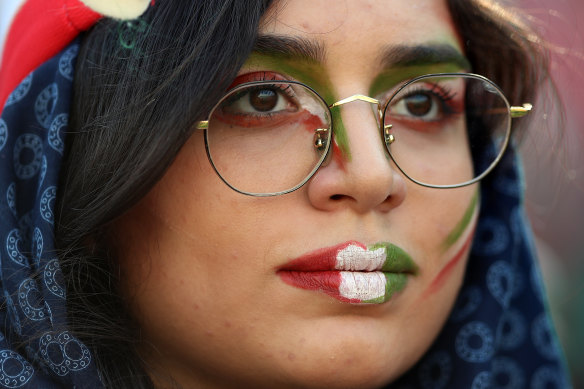 Wearing her colours proudly, a fan shows her support at the Iran match.