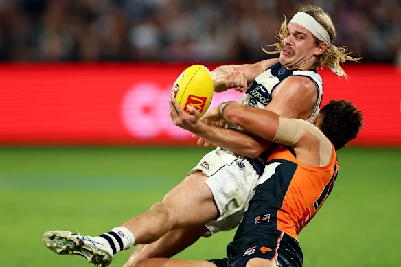 Geelong’s Bailey Smith under pressure from GWS’s Finn Callaghan.