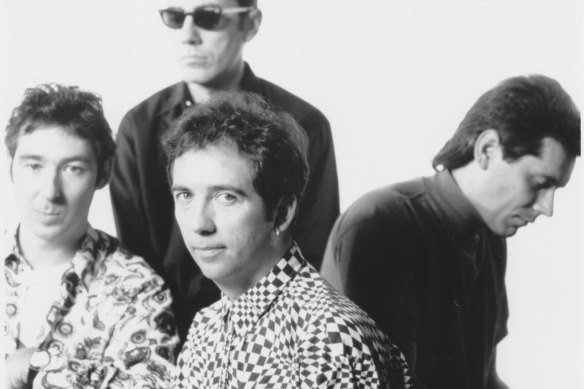  Pete Shelley [front, centre], singer, songwriter and founding member of the band, 1990.