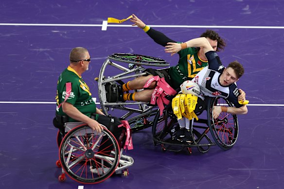 Bayley McKenna tackles England’s Rob Hawkins in the 2022 Wheelchair Rugby League World Cup.