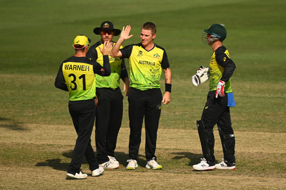 Adam Zampa (centre) celebrates taking another wicket in Australia’s defeat of Bangladesh.