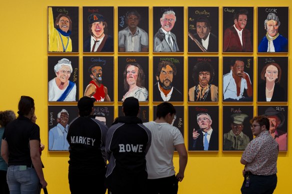 Gallery visitors view the artwork by Vincent Namatjira at the National Gallery on Friday.