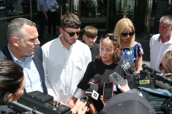 Colin Waters' brother Steven, son Kieran and wife Paula speak to the media outside court on Wednesday.