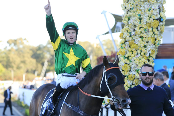 Tommy Berry  celebrates as Ole Kirk returns to scale after the Golden Rose.