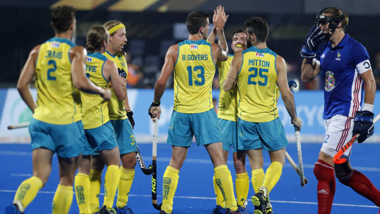 France's captain Victor Charlet (right) walks past as the Kookaburras celebrate Blake Govers' goal.