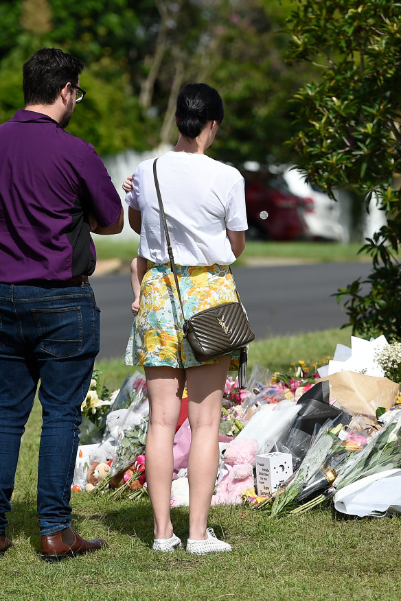 Mourners continued to pay their respects at the scene of the murder at Camp Hill on Friday.