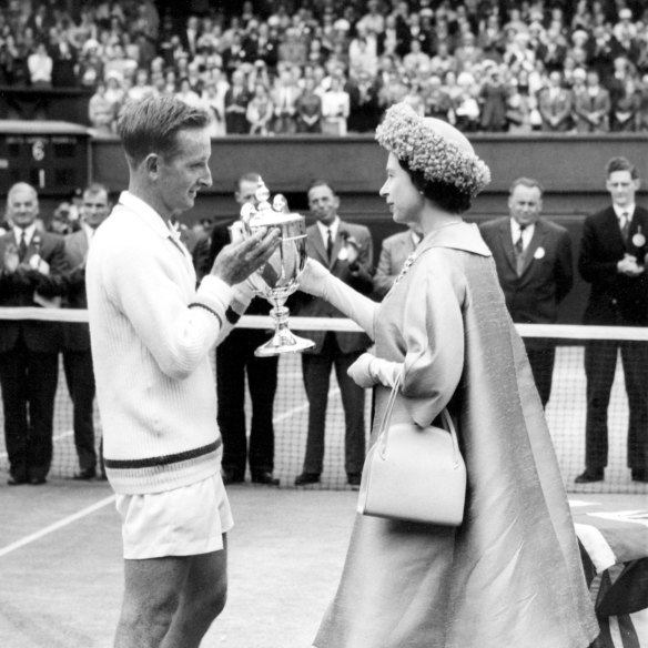 The Queen presents Laver with the men’s singles trophy after his 1962 Wimbledon triumph.