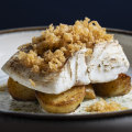 Butter-poached cod fillet topped with beer-batter bits.