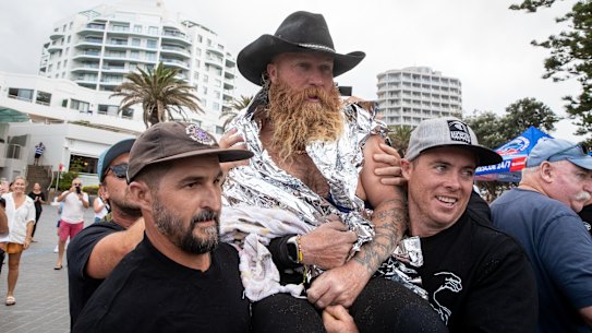 Former pro-surfer Blake Johnston leaves the water after the mammoth surf session. 
