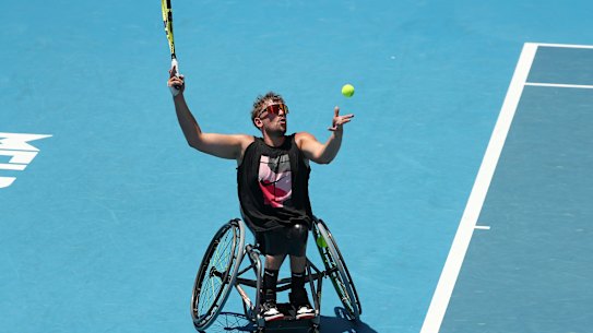 Dylan Alcott serves.