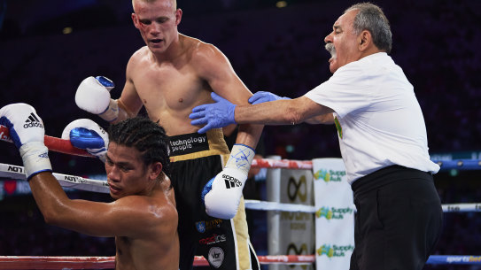 SYDNEY, AUSTRALIA - DECEMBER 16: Liam Wilson knocks down Rodynie Rafol during the Undercard fight prior to the light-middleweight World Title elimination bout between Tim Tszyu and Bowyn Morgan at Bankwest Stadium on December 16, 2020 in Sydney, Australia. (Photo by Brett Hemmings/Getty Images)
