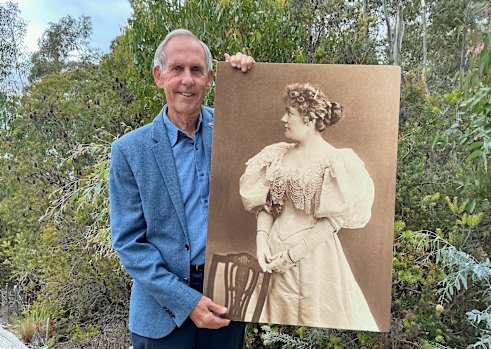 Inspiring life: Dr Bob Brown holding a photo of soprano Amy Sherwin.