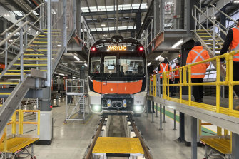 A new intercity fleet train sits idle in a Central Coast maintenance facility amid a prolonged stand-off between rail unions and the NSW government.