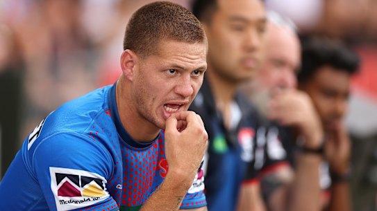 Kalyn Ponga watching from the bench on Sunday.