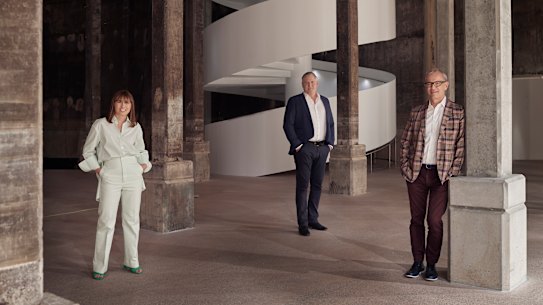 Art Gallery of NSW director Michael Brand (right) with his deputy Maud Page (left) and head of development John Richardson inside the Tank, a giant underground space which stored oil during World War II.