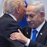 President Donald Trump talks with Israel’s Prime Minister Benjamin Netanyahu at the Knesset.