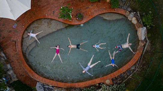 The Mayes family cool off in their pool in western Sydney as temperatures reached over 40 degrees on Thursday.