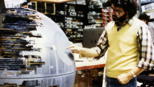 George Lucas with one of the models used in Star Wars: Episode IV