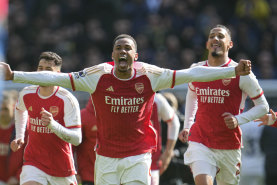 Arsenal teammates celebrate their win over Tottenham.