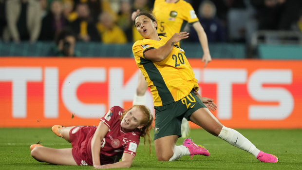 Sam Kerr challenges with Denmark’s Stine Ballisager.