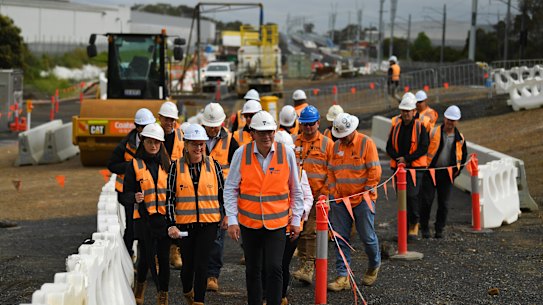 Victorian Premier Daniel Andrews (centre) tours a level crossing removal site.
