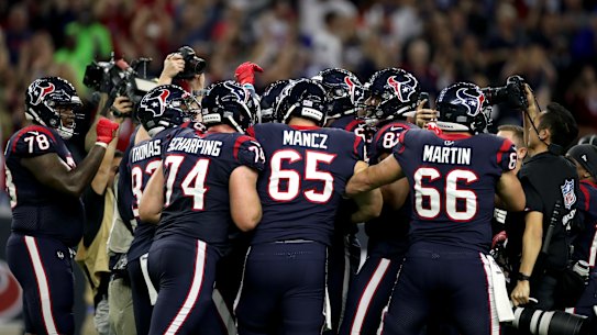 HOUSTON, TEXAS - JANUARY 04:  Ka'imi Fairbairn #7 of the Houston Texans is congratulated by his teammates after his game-winning field goal in overtime to give his team the 22-19 win against the Buffalo Bills reacts in the AFC Wild Card Playoff game at NRG Stadium on January 04, 2020 in Houston, Texas. (Photo by Christian Petersen/Getty Images)