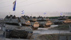 Israeli tanks head towards the Gaza Strip border in southern Israel.