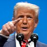 US President Donald Trump is flanked by Defence Secretary Pete Hegseth and Secretary of State Marco Rubio as speaks to the press following the NATO summit.
