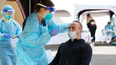 Aaron Johnson has a COVID-19 test at a popup clinic run by St Vincent's Hospital.