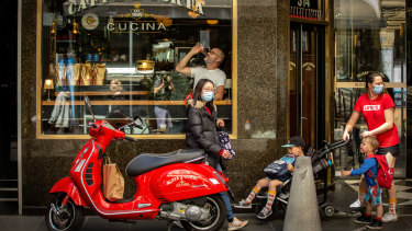 People take to Melbourne's streets on Wednesday. 