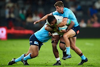 The Waratahs wrap up Isoa Nasilasila at CommBank Stadium.