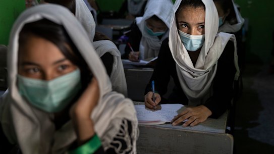 Female students in class prior to the Taliban seizing power last year.