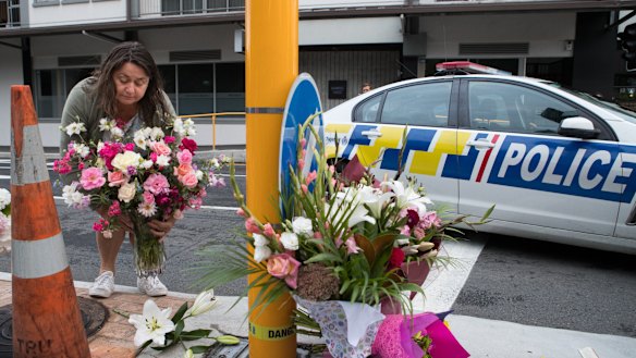 Locals gather to lay flowers near Masjid Al Noor Mosque in Christchurch after a terror attack by a gunman killed 49 people.