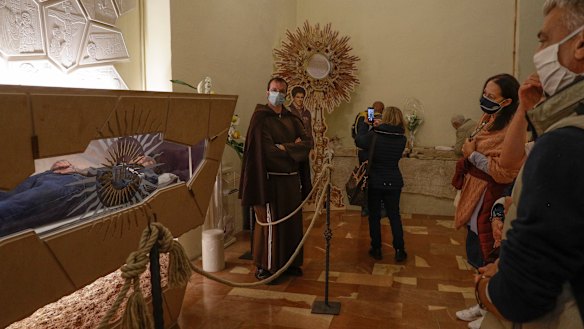 Carlo Acutis, a 15-year-old Italian boy who died of leukemia in 2006, lies in state ahead of being beatified by Cardinal Agostino Vallini, in Assisi, Italy.