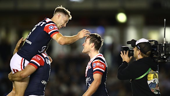 Sam Walker and Luke Keary celebrate a brave win in last year’s elimination final against the Sharks.