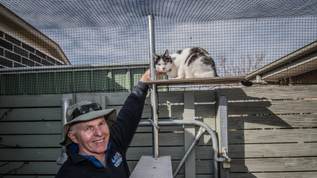 Thomas Graham, who helps install cat containment spaces around Canberra.