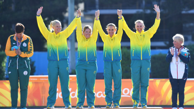 (L-R) Gold medalists Natasha Scott, Rebecca van Asch, Carla Krizanic and Kelsey Cottrell of Australia are seen celebrating after winning the Lawn Bowl's Women's Fours Gold Medal.