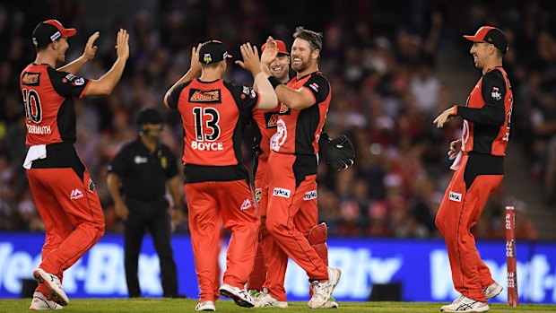 Daniel Christian of the Renegades, second from right, reacts after dismissing Michael Klinger of the Scorchers.