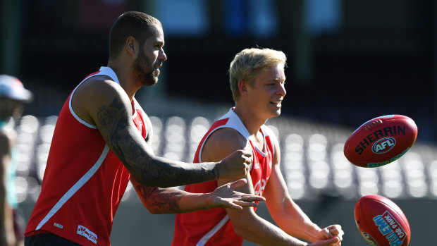 Back in action: Lance Franklin at training during the week with Isaac Heeney.